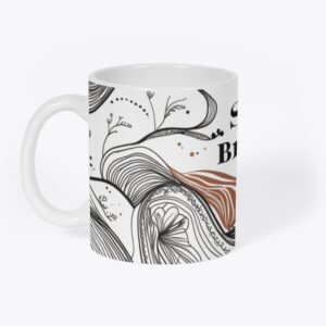 Off-white ceramic mug with calming tribal designs and wellness-inspired accents, perfect for morning rituals.