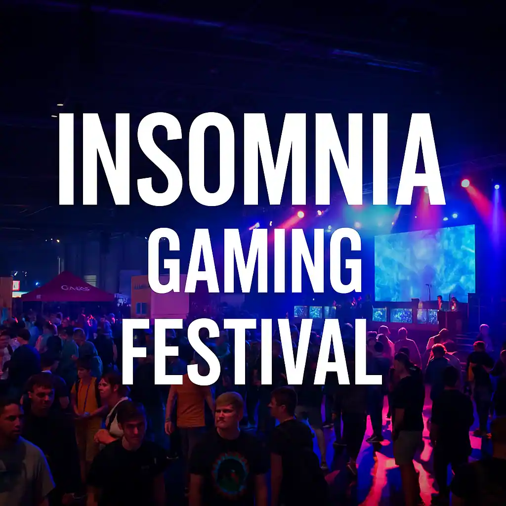 Crowd of gamers attending the Insomnia Gaming Festival at an indoor venue with stage lighting, large screens, and immersive gaming activities.